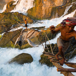 A Lao fisherman harvests fish from the powerful Khone Falls, following a tradition in one of the world’s most dangerous fishing places.